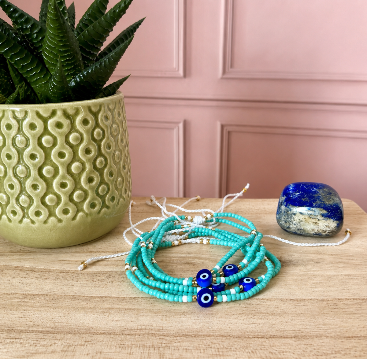 Bracelet en perles vert d'eau avec oeil turc